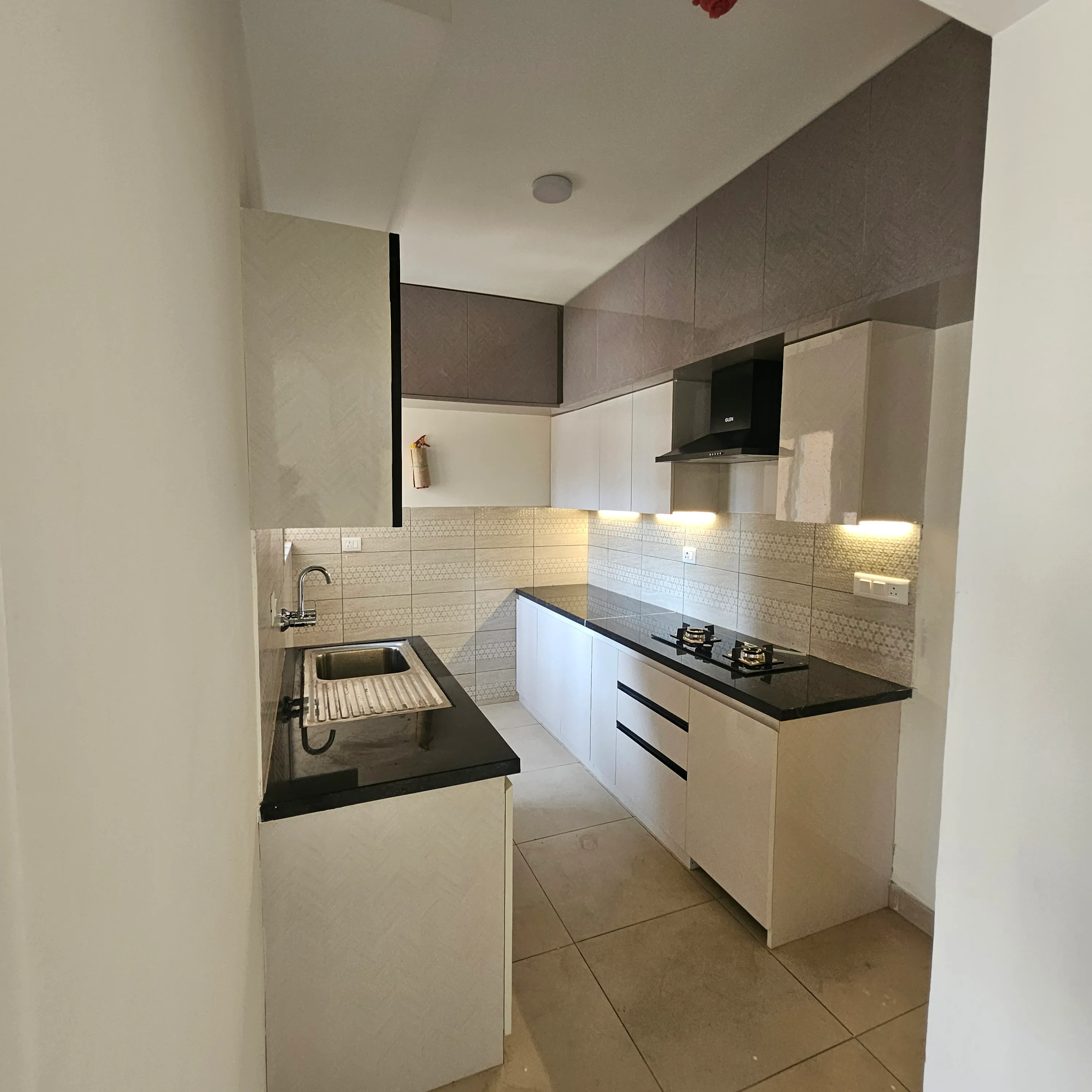 Elegant U-shaped kitchen with granite countertops