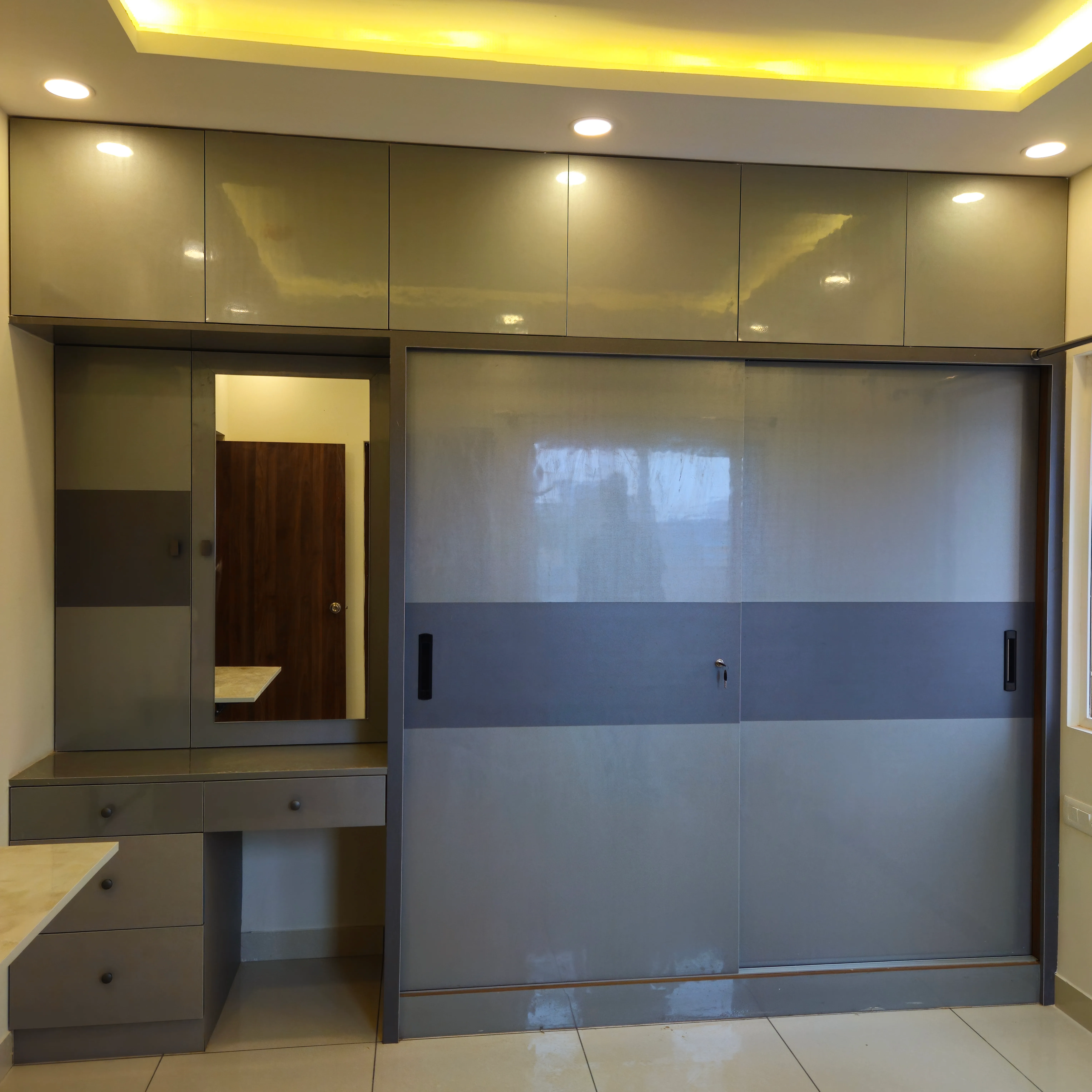 Corner wardrobe with mirror and lighting
