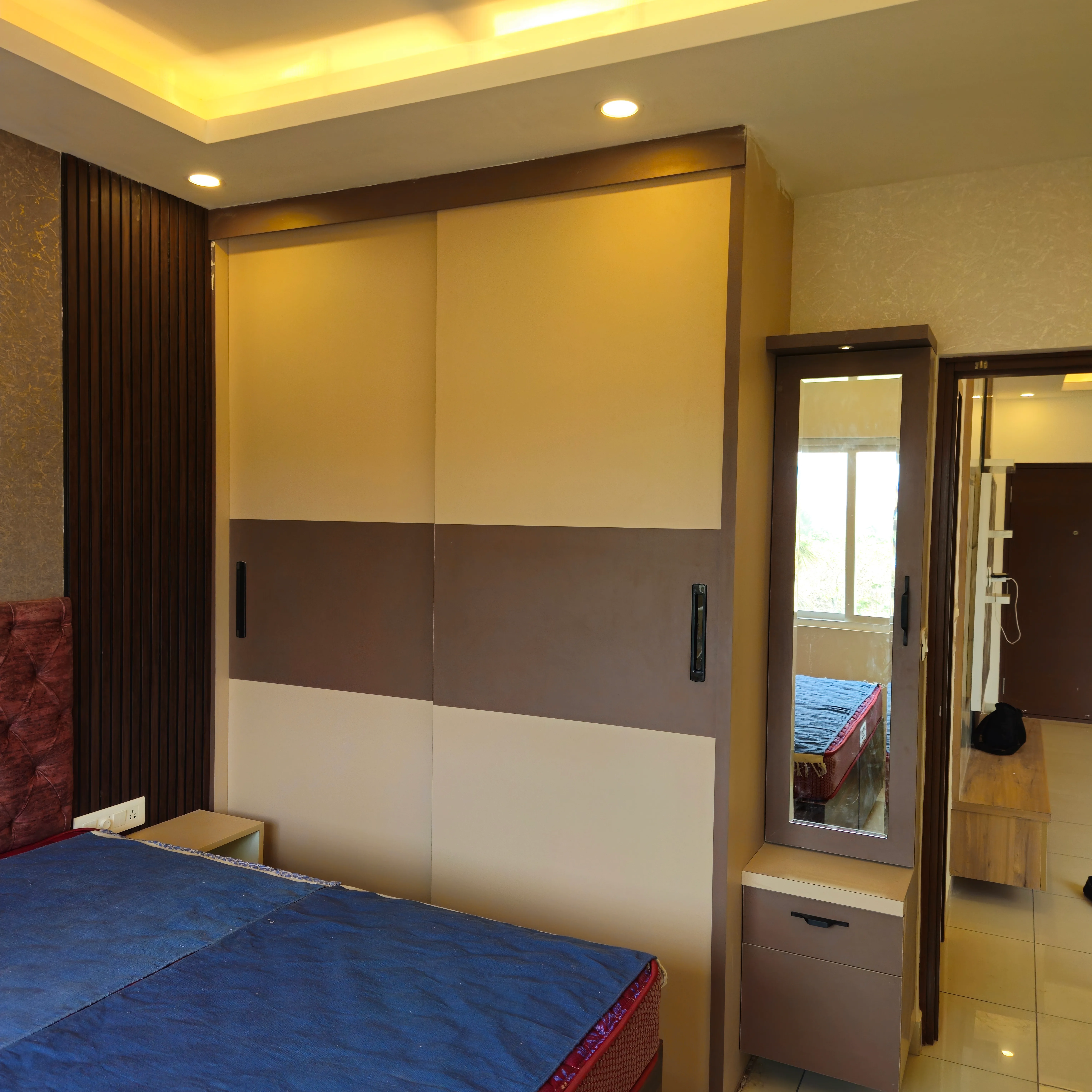 Corner wardrobe with mirror and lighting