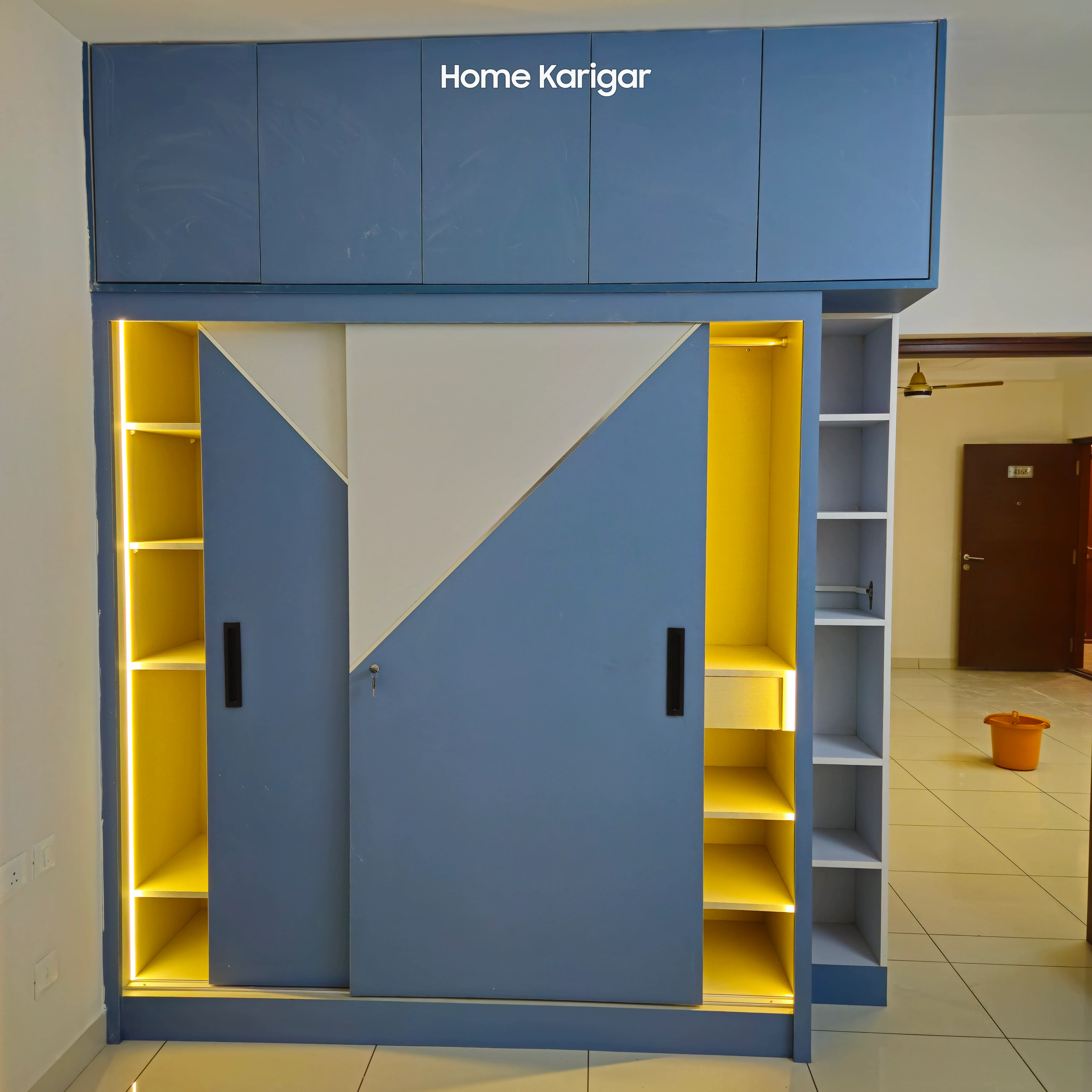 Corner wardrobe with mirror and lighting